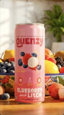 Original campaign still of a Thequenzy soda can among fruit